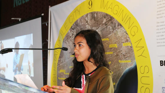 Student speaking at microphone